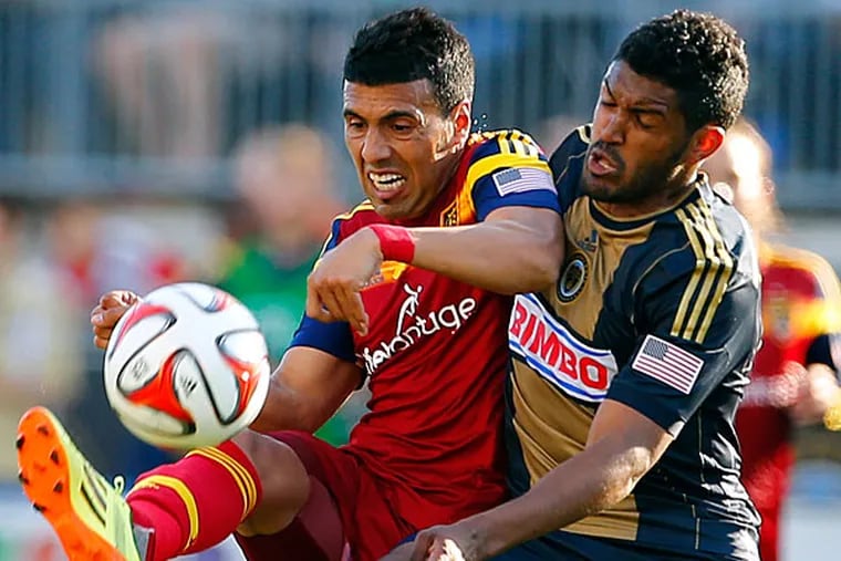 Real Salt Lake's Javier Morales, left, of Argentina, battles for the
ball with Philadelphia Union's Sheanon Williams (25) during the second
half of an MLS soccer match at PPL Park in Chester, Pa., Saturday,
April 12, 2014. The match ended in a 2-2 draw. (Rich Schultz/AP)