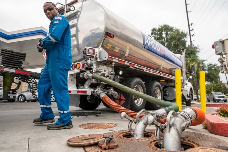 A driver delivers 8,500 gallons of gasoline at an ARCO gas station in Riverside, Calif., Saturday, May 28, 2022.