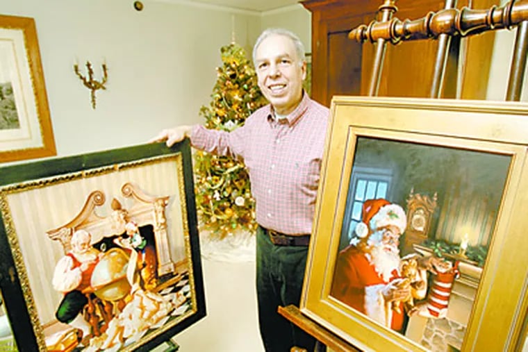 Artist and illustrator Ernie Norcia of Wallingford is know for his paintings of Santa as well as other illustrations. He is shown in his home with 2 of his Santa paintings. (Charles Fox / Staff Photographer)