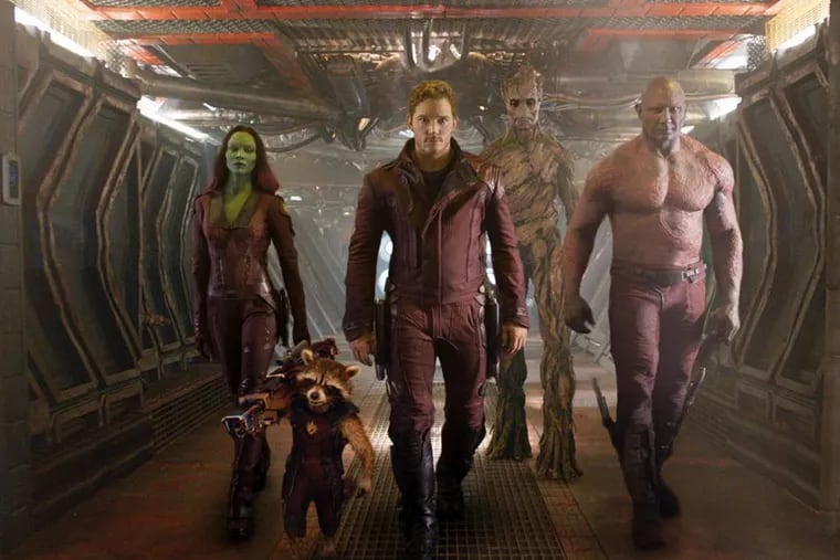 (from left) Zoe Saldana, the character Rocket Racoon, voiced by Bradley Cooper, Chris Pratt, the character Groot, voiced by Vin Diesel and Dave Bautista in a scene from "Guardians of the Galaxy." (AP Photo/Disney - Marvel)