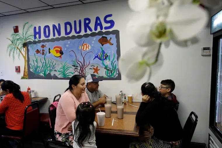 In this Thursday, June 27, 2019 photo diners eat in a Honduran-style restaurant in Chelsea, Mass. A recent study by the Pew Research Center shows the number of Central Americans in the United States increased over the last decade. Chelsea has exemplified that trend with a population that is more than 60 percent Latino. (AP Photo/Steven Senne)