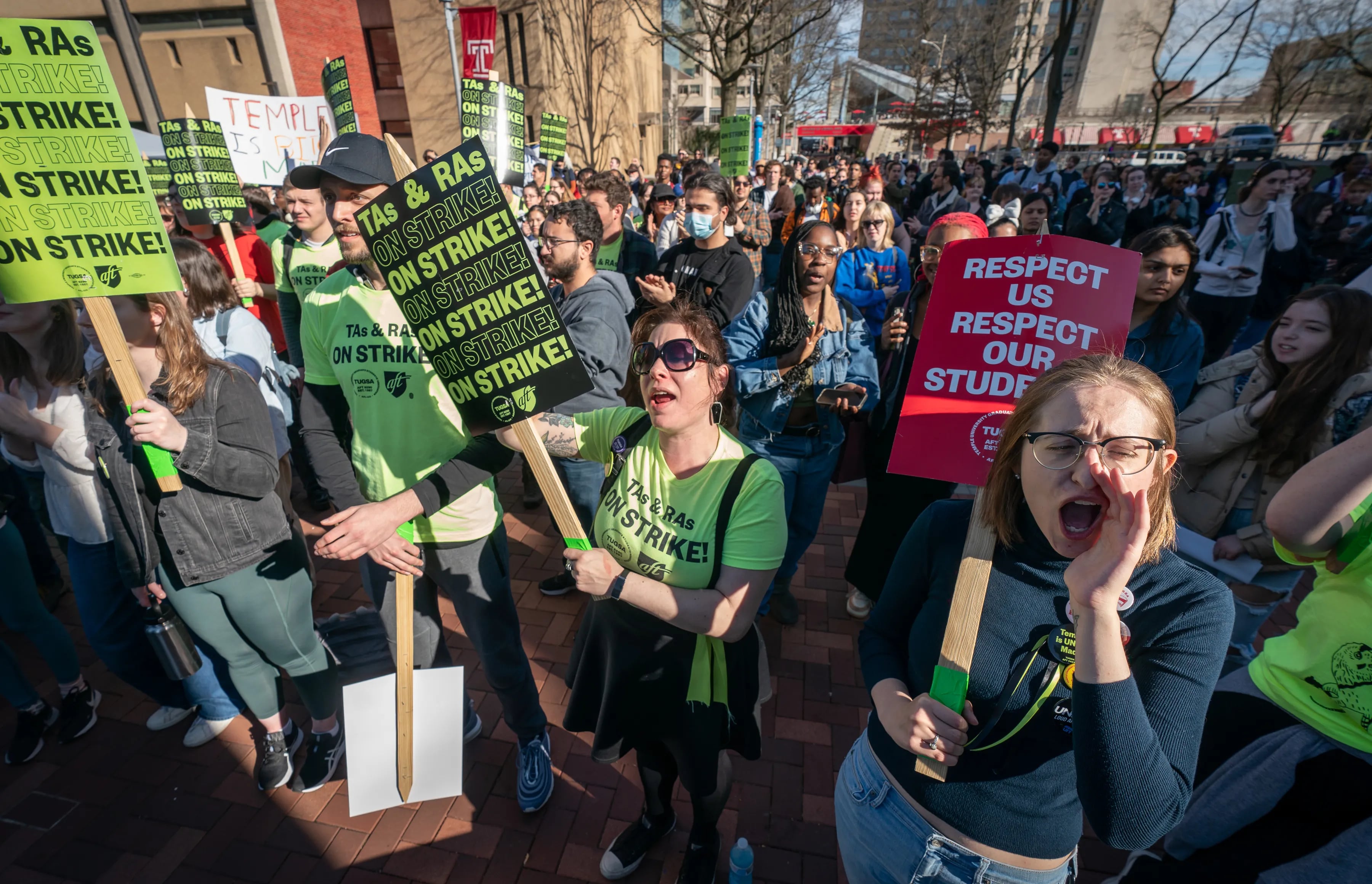 Ariel Natalo-Lifton (front center) and Laura Waters (front right), TUGSA vice president, protest at Temple University where students walked out of class on Wednesday, Feb. 15, 2023, in Philadelphia, in support of the teaching assistants and research assistants, some of whom are on strike.