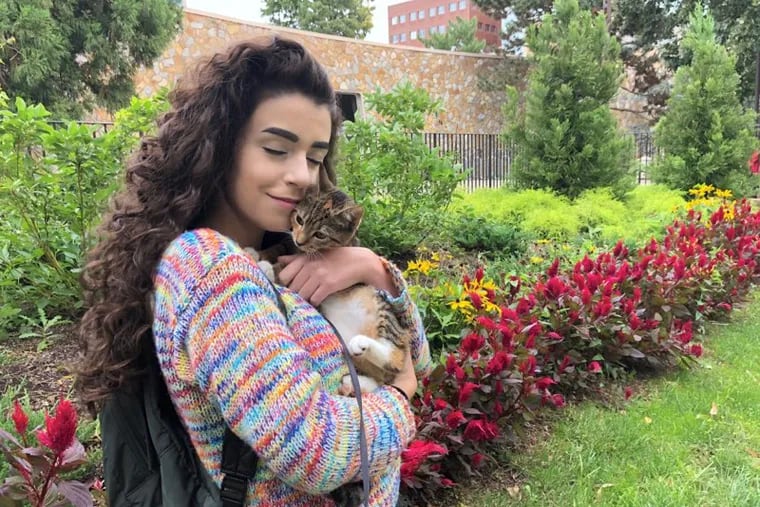 Temple sophomore Liv Tempesta with her cat, Luna. Last year, Tempesta lived on campus with her other cat, Skittles, who served as her emotional-support animal and was a treatment for depression and anxiety.