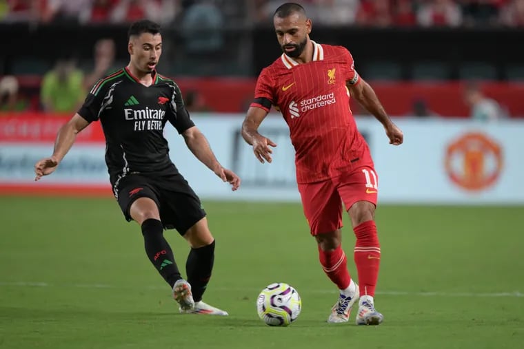 Liverpool star Mohamed Salah (right) scored his team's first goal of the game.