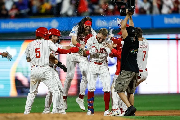 Kody Clemens (center) celebrates his walk-off single against the Rays.