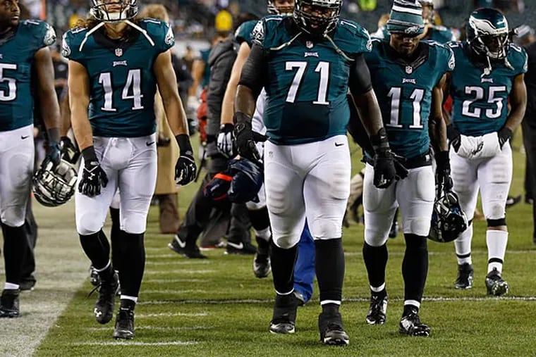 Eagles' Vinny Curry, Riley Cooper, Jason Peters, Josh Huff and LeSean
McCoy walk off the field after losing to the Dallas Cowboys. (Yong Kim/Staff Photographer)