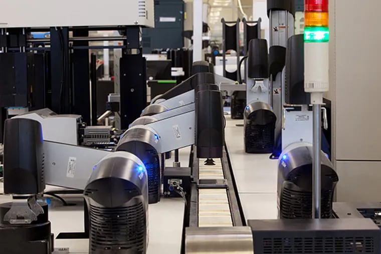 The robots and computer-assisted screening machines used at GSK's facility in Upper Providence help researchers search for possible combinations of molecules that might lead to a safe and effective drug. (Photo by Alan Brian Nilsen, courtesy of GSK)