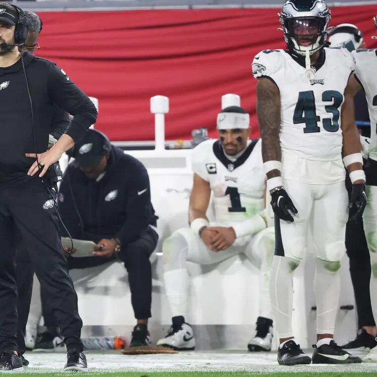 Eagles head coach Nick Sirianni (left) watches as the final series of the game. Eagles lose 32-9 to the Buccaneers in the wild-card round of the NFL playoffs at Raymond James Stadium in Tampa, Fl. on Monday, Jan. 15, 2024.