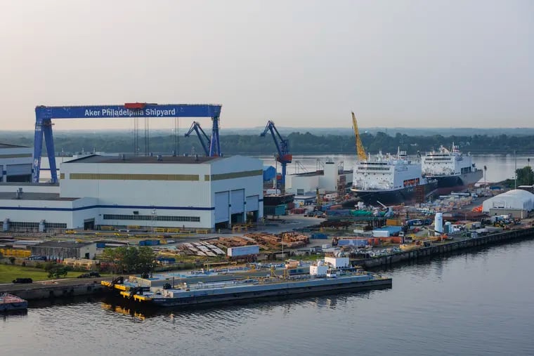 Philly Shipyard, next to the mouth of the Schuylkill as it dumps into the Delaware River, as seen from southbound I-95. The two ships, Patriot State (left) and State of Maine (closest to the Delaware), that are still under construction are federally funded National Security Multi-Mission Vessels (NSMVs) for the U.S. Maritime Administration. The shipyard, whose owners led by the Norway-based Aker industrial group have agreed to sell the yard for $100 million to the South Korea-based Hanwha group, is building five such vessels. It expects to lose money on the contract, due partly to a scarcity of skilled U.S. shipyard labor.