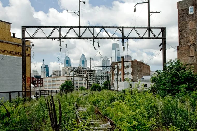 The Philadelphia city skyline as viewed from the Reading Viaduct, envisioned as a part of future park.