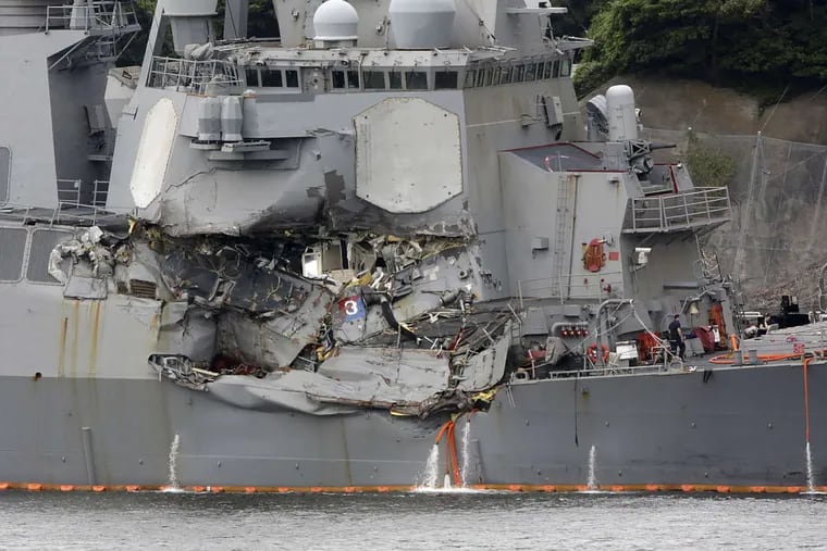 Damaged part of the USS Fitzgerald is seen at the U.S. Naval base in Yokosuka, Japan.