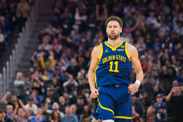 Golden State Warriors guard Klay Thompson (11) reacts to scoring during the first half of an NBA basketball game against the Utah Jazz, Sunday, April 7, 2024, in San Francisco.