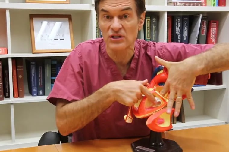 Oz_Columbia_Vid_01.png:
In
a YouTube video
posted by the Columbia University Department of Surgery several years a
go,
Mehmet Oz discussed the origins of MitraClip and, using a model of the heart, explained how the
device is used to treat leaky mitral valves. The process involves essentially stapling the mitral valve
so it works more effectively, he said. MitraClip yie
lded “massive improvements” in a group of people
with heart failure, he said. (Screengrab of a Columbia University Department of Surgery video)