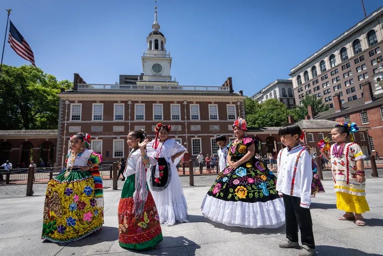 Young dancers from Ñuuxakun, a group that performs Baile Folclorico Mexicano, participate in the Red, White, & Blue To-Do Pomp & Parade on Independence Mall Tuesday.