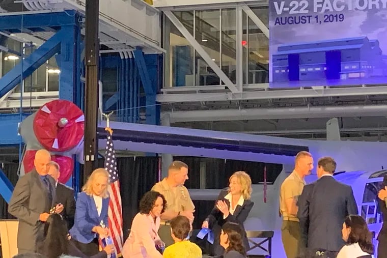 From left: UAW Local 1069 President Mike Tolassi, U.S.Rep. Mary Gay Scanlon (D-Pa.), Boeing Vice President Kristin Houston, Col. Matthew Kelly USMC, Boeing CEO for military and space Leanne Caret, Lt. Gen Steven Rudder USMC, and U.S. Rep. Don Norcross (D-N.J.) at opening ceremony for $130 million V-22 Osprey tilt-rotor military aircraft plant at Ridley, Pa. The refurbished, air-conditioned plant lets Boeing refurbish and test completed V-22s while continuing to build new fuselages.