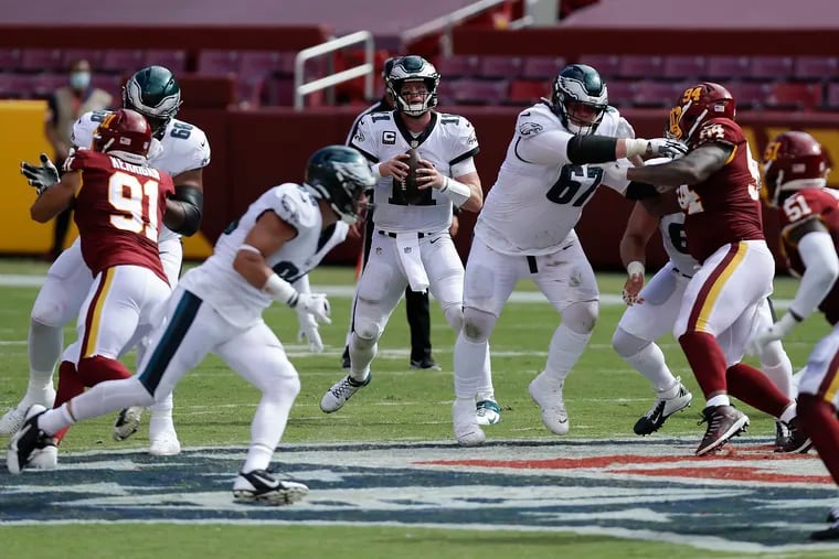 Eagles quarterback Carson Wentz is in his fifth season, and yet there were multiple times in Sunday’s loss when he unnecessarily tried to extend a play, and it hurt his team.

Eagles quarterback Carson Wentz looks for receiver against the Washington Football Team on Sunday, September 13, 2020.