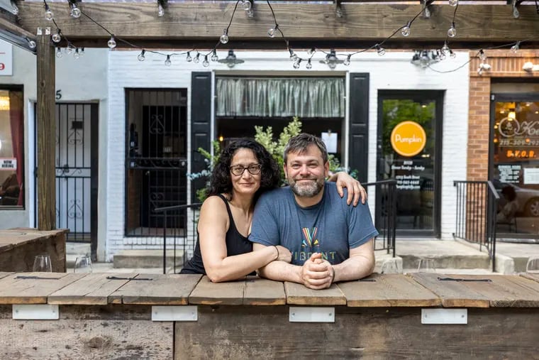 Co-owners of Pumpkin BYOB Hillary Bor and Ian Moroney pose in the streetery in front of their restaurant.