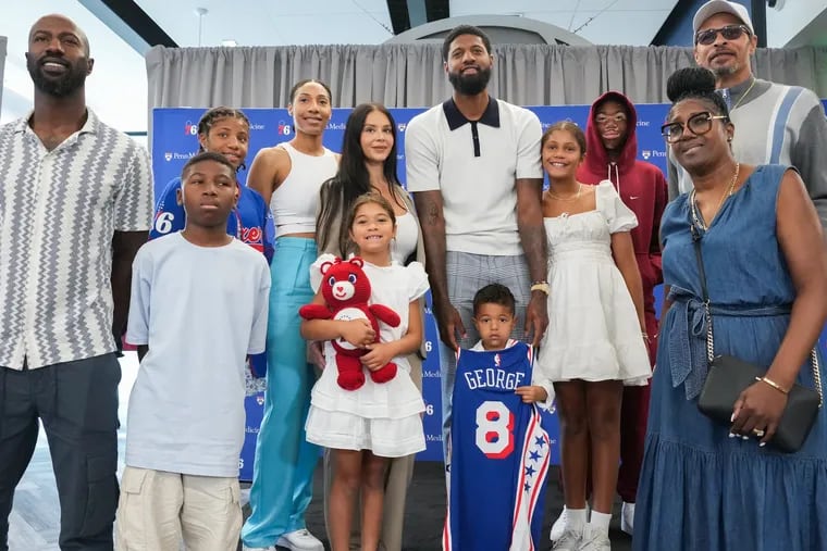 Paul George (center) was recently joined by his dad, Paul George Sr. (far right) on his podcast.