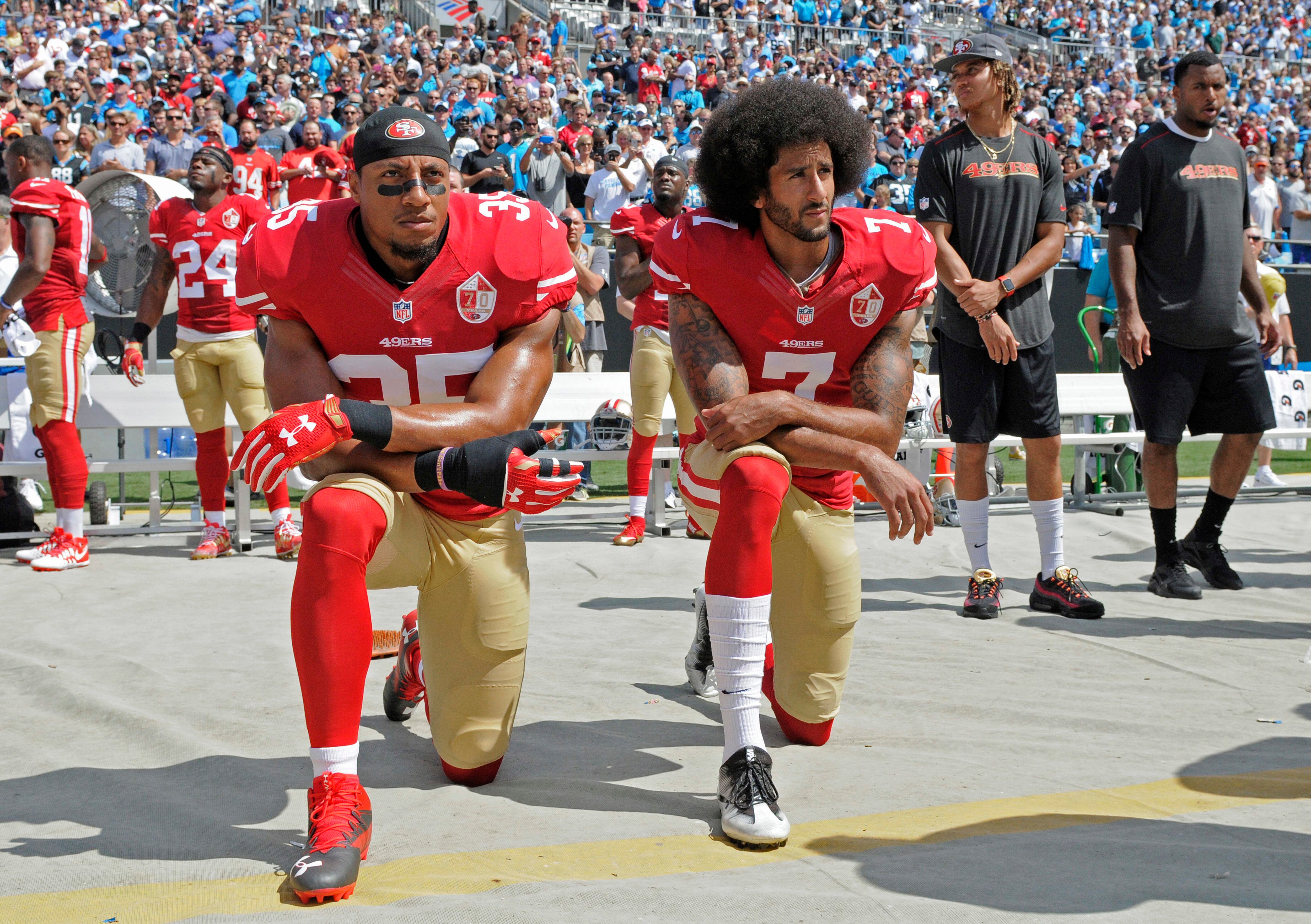 San Francisco 49ers cheerleader kneels during national anthem