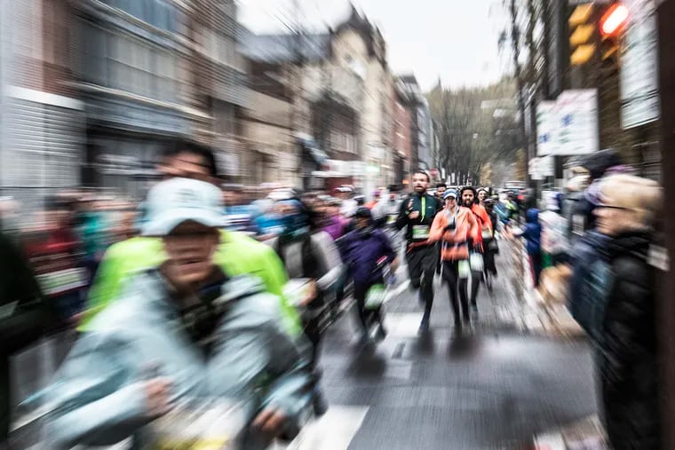 Participants run through the streets of Old City during the 2019 Philadelphia Marathon in Philadelphia, Pa. Sunday, November 24, 2019.