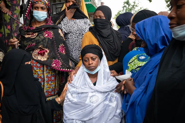 Tennah Kromah, the mother of 8-year-old Fanta Bility, shown here surrounded by family members at the Masjid Ahlus-Sunnah Wal-Jammaah, in Southwest Philadelphia, August 31, 2021.