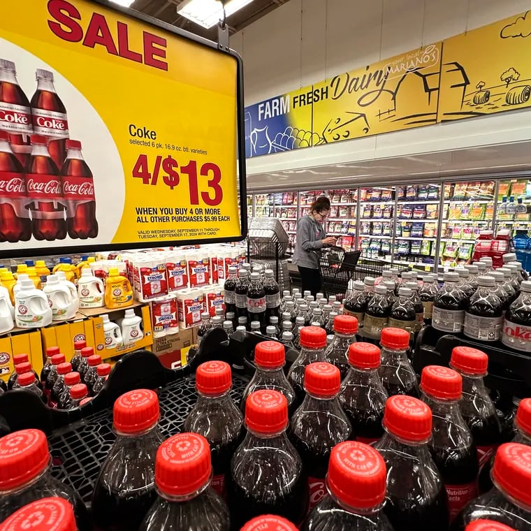 A customer passes an array of beverages while shopping at a grocery store in Chicago Sept. 19, 2024.