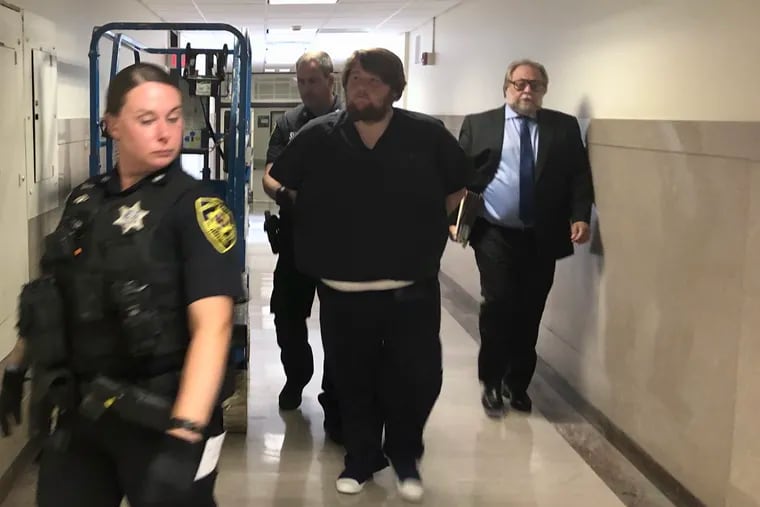 Patrick Doran (center) was sentenced Monday to 3 1/2 to 7 years in state prison. Doran owned an uninsured and unregistered dump truck involved in a crash that killed Kellie Adams and her unborn daughter, Emersyn.