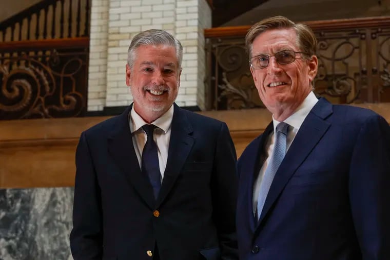 Drexel President John A. Fry, left, and Interim President Denis O'Brien discuss the transition in leadership as Fry prepares to depart for a new job as president of Temple University.