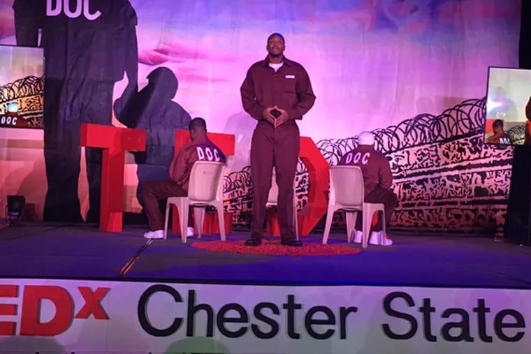 Inmate Quran Herrington performs at a TEDx event building stronger relationships between inmates and their families at the State Correctional Institution in Chester on Wednesday. Herrington’s wife and step-daughter were in the audience.