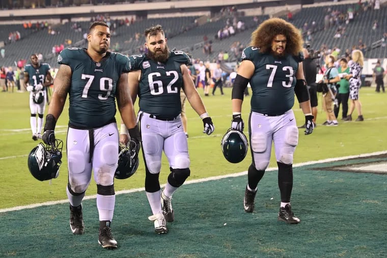 Brandon Brooks (left), Jason Kelce and Isaac Seumalo walk off the field after the Eagles lost to the Vikings earlier this season.