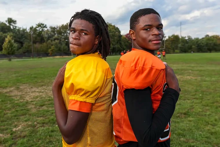 Quarterback Jalen Harris (left) and his twin brother Daron, a defensive back, during practice at Chester High School on Thursday.