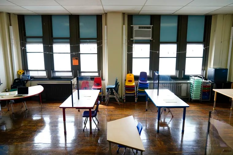 Desks are spaced apart ahead of planned in-person learning at an elementary school in Philadelphia in 2021.