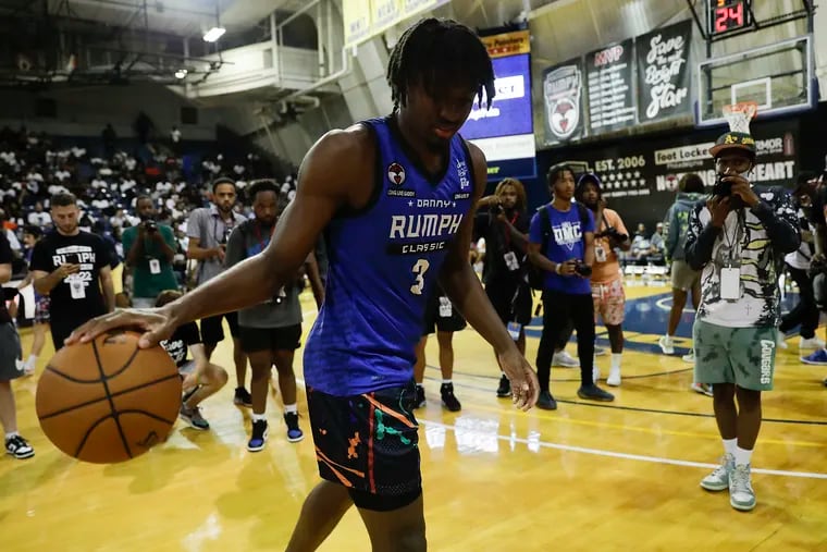 Team FOE guard Tyrese Maxey dribbles the basketball wearing his Rumph Classic jersey before the championship Rumph Classic game in the TruMark Financial Center at La Salle University on Monday.