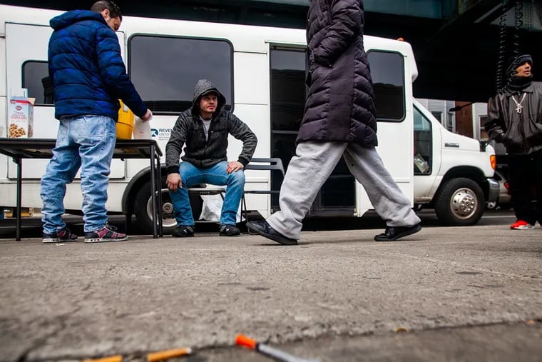A bus run by the organization Prevention Point parks at Kensington and Allegheny avenues in Philadelphia to offer harm-reduction services to drug users in the area. Harm reduction efforts will continue to save lives across the city, writes emergency doctor Priya E. Mammen.