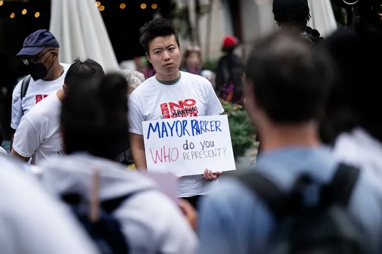 A supporter holds a sign in protest during a “no Sixers arena rally” outside Philadelphia City Hall just before Mayor Cherelle L. Parker announced her support of an arena at 10th and Market Streets.