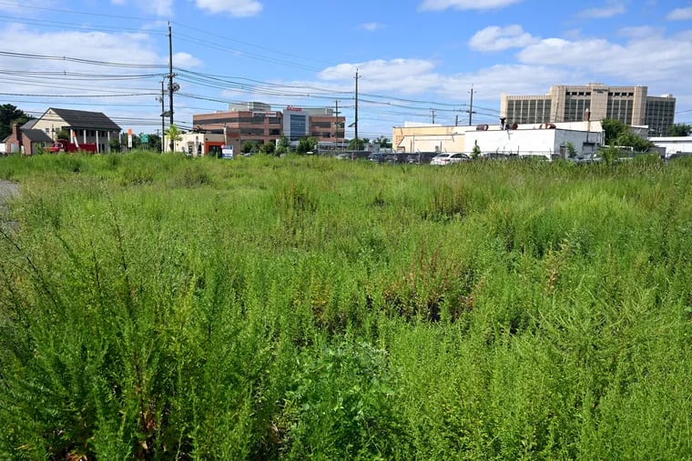 View looking south at Route 70 and South Union Avenue in Cherry Hill. The weedy 12-acre expanse of ground will be redeveloped with two hotels, a restaurant, and a coffee shop. A car wash that has been doing business there since the 1960s will be remodeled as part of the project.