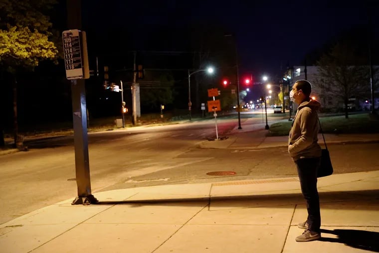 Miguel Garcia waits at a bus stop in Chester for the first leg of his commute to work in Horsham. Due to SEPTA's reduced service, Garcia has to take two subways and two buses to get to his job — a journey that takes 2½ to three hours.
