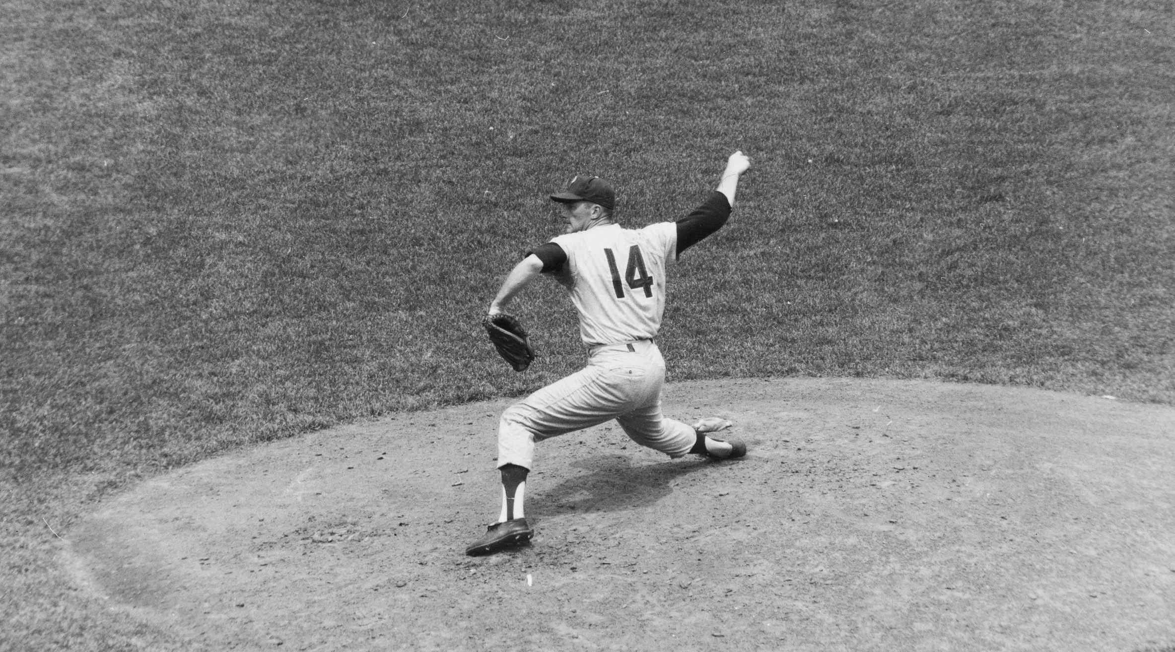 In this June 21, 1964 file photo, Jim Bunning of the Philadelphia Phillies pitches a perfect game against the New York Mets at Shea Stadium in New York. 