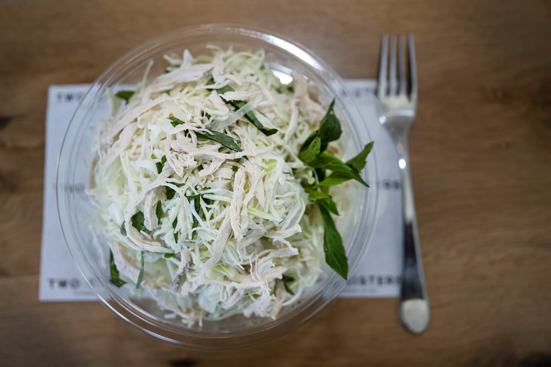 The goi ga, a shredded cabbage salad, is tossed to order in a lime vinaigrette with pho-poached chicken and Thai basil at Two Sisters Vietnamese Eatery in Ventnor City.