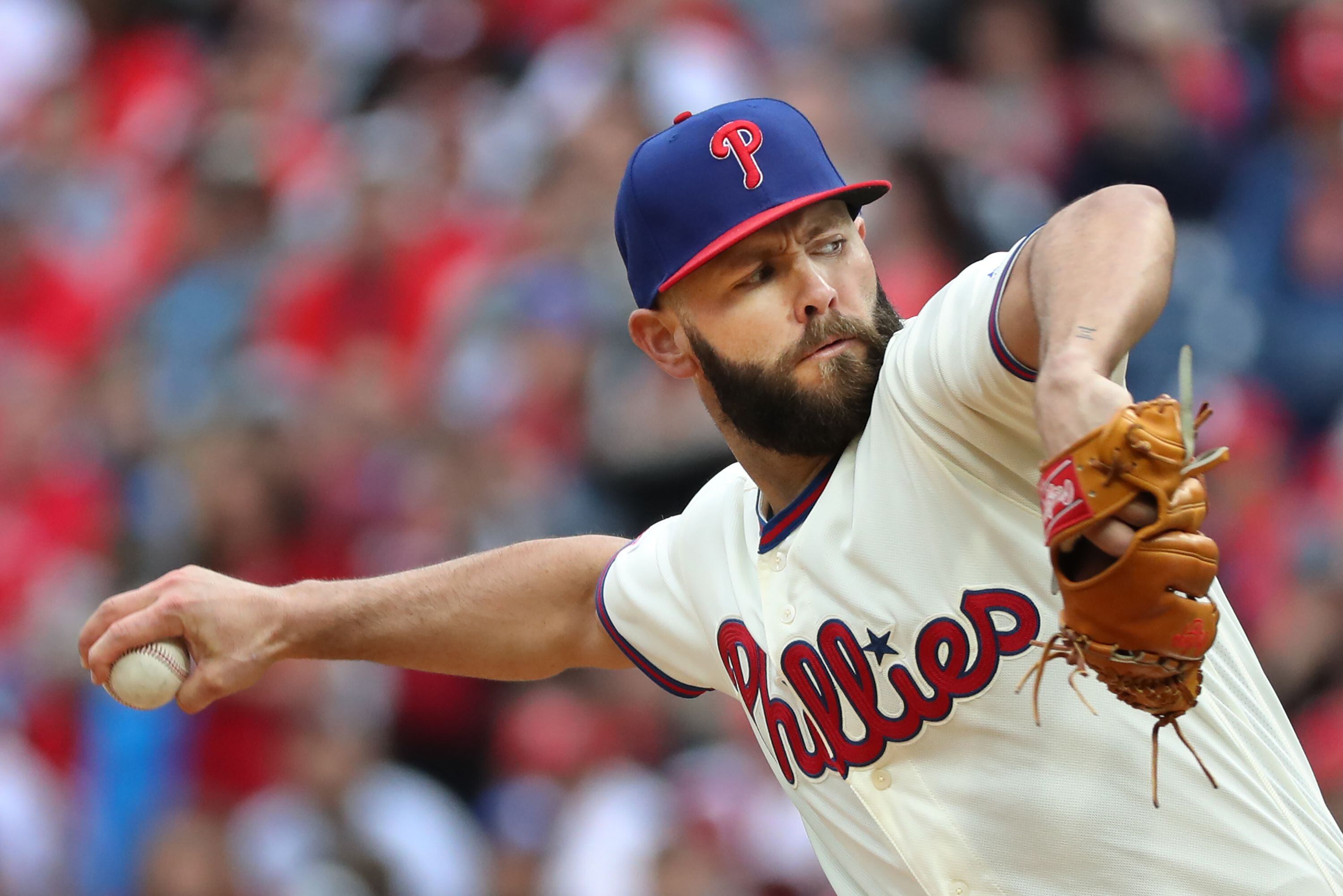 Jake Arrieta pitches into 9th, Phillies hold off Mets