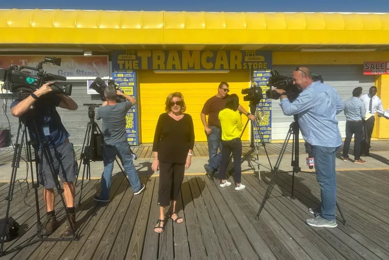 Floss Stingel, who recorded "Watch the Tram Car Please," message more than 50 years ago, on the North Wildwood Boardwalk after announcing that she is suing Wildwood, Morey's Piers and others for compensation. She says she's never received any money despite her voice being used for commercial and tourism purposes.