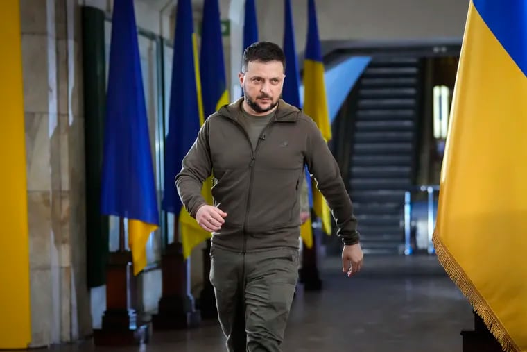 Ukrainian President Volodymyr Zelensky walks to a news conference in a city subway under a central square in Kyiv, Ukraine, in 2022.