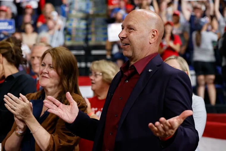 Doug Mastriano with his wife, Rebecca, during the Save America rally at the Mohegan Sun Arena at Casey Plaza in Wilkes-Barre on Sept. 3.