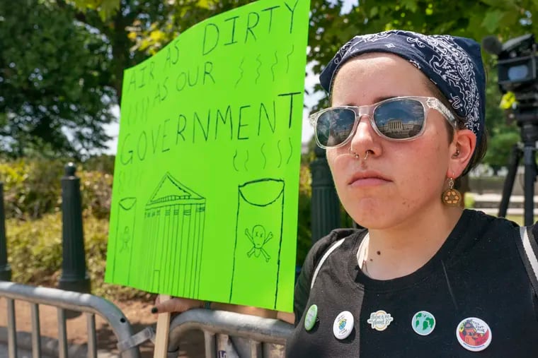 Erin Tinerella, of Chicago, protests outside the Supreme Court over Thursday's ruling in "West Virginia v. EPA."