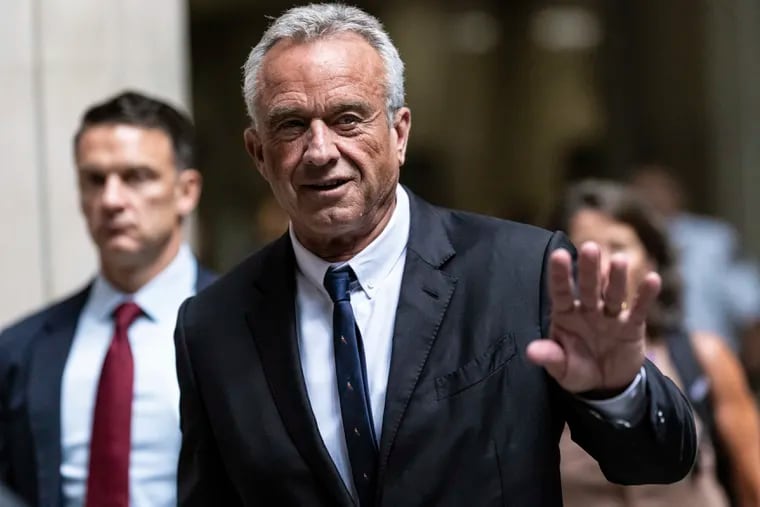 Independent presidential candidate Robert F. Kennedy Jr., waves to the media outside the Nassau County Supreme Court in Mineola, N.Y.