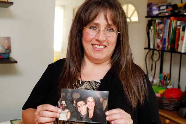 Lisa MacMullin shows her favorite picture of David and her, taken on Oct.15, 2011.
( AKIRA SUWA  /  Staff Photographer ) 

A portrait of Lisa MacMullin in her home. She and her husband, Brian, have struggled with her son, David's drug addiction for five years.
