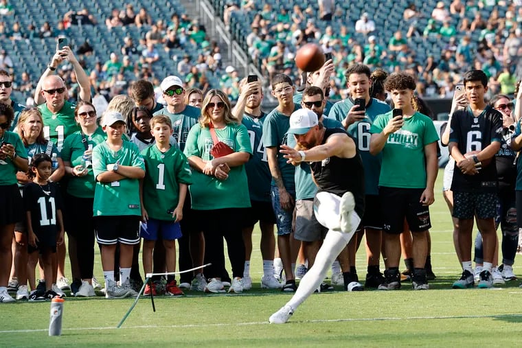 Eagles fans watch place kicker Jake Elliott practice.