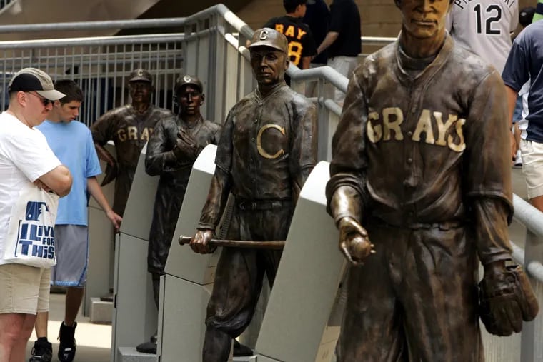 A display honoring Negro Leagues players at PNC Park in Pittsburgh includes statues of (front to back) Joseph "Smokey Joe" Williams, Oscar Charleston, William Julius Johnson, and Walter Fenner Leonard.
