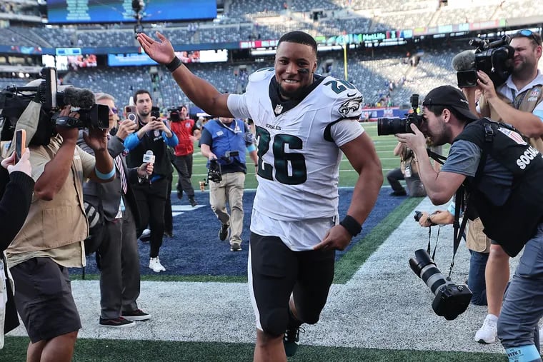 Eagles running back Saquon Barkley gestures to the crowd as he runs off the field after the Philadelphia Eagles win 28-3 over the New York Giants at MetLife Stadium on Sunday, Oct. 20, 2024.