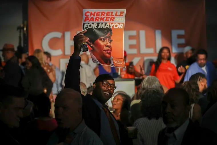 Cherelle Parker supporters hold up her campaign poster at her watch party Tuesday. Parker has won the Democratic nomination for mayor of Philadelphia.